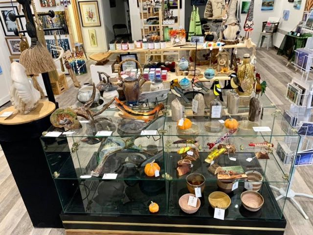 Display case of carvings, stained glass and handmade gifts at On the Avenue
