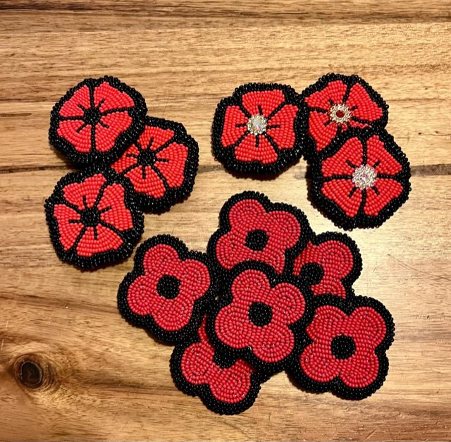 Hand-beaded red and black poppy pins