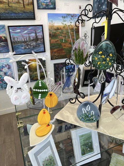 Fused glass spring ornaments on a stand