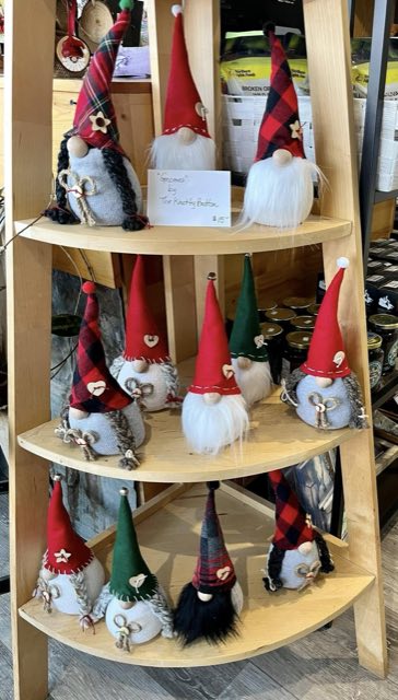 Handmade fabric gnomes on a shelf