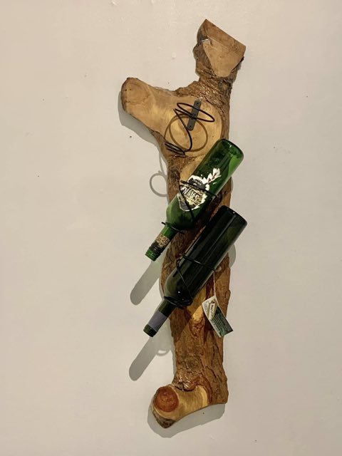 Live-edge wood wall wine rack